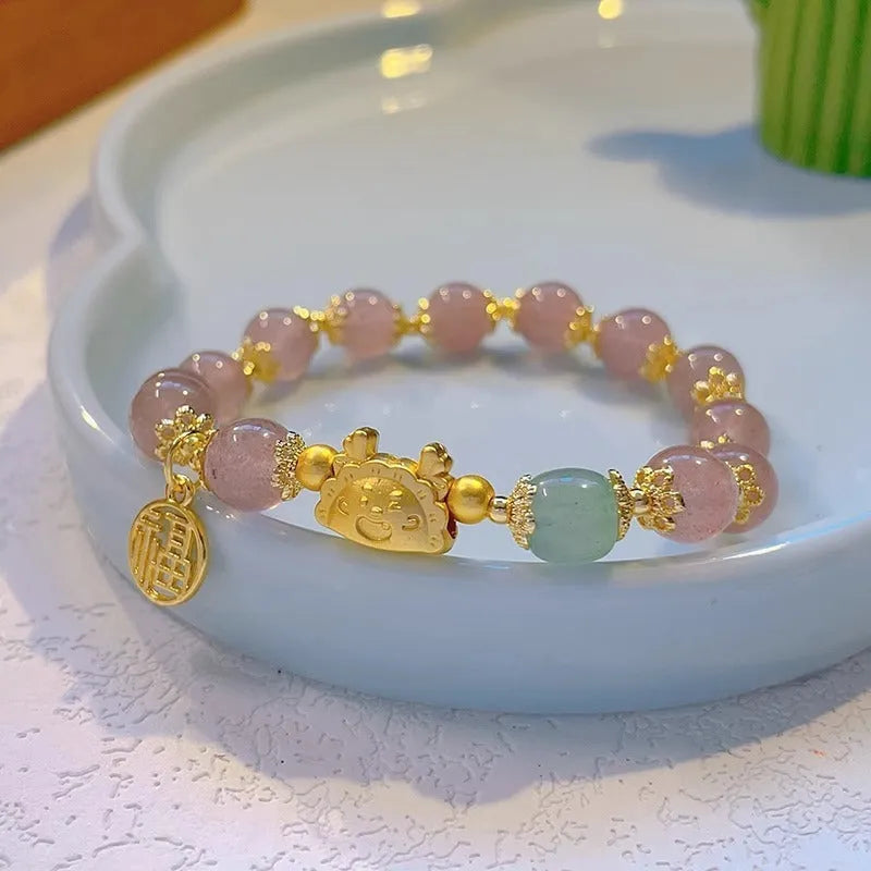 Women's floral glazed glass bracelet with animal zodiac charms in red, pink and white bead colour variations