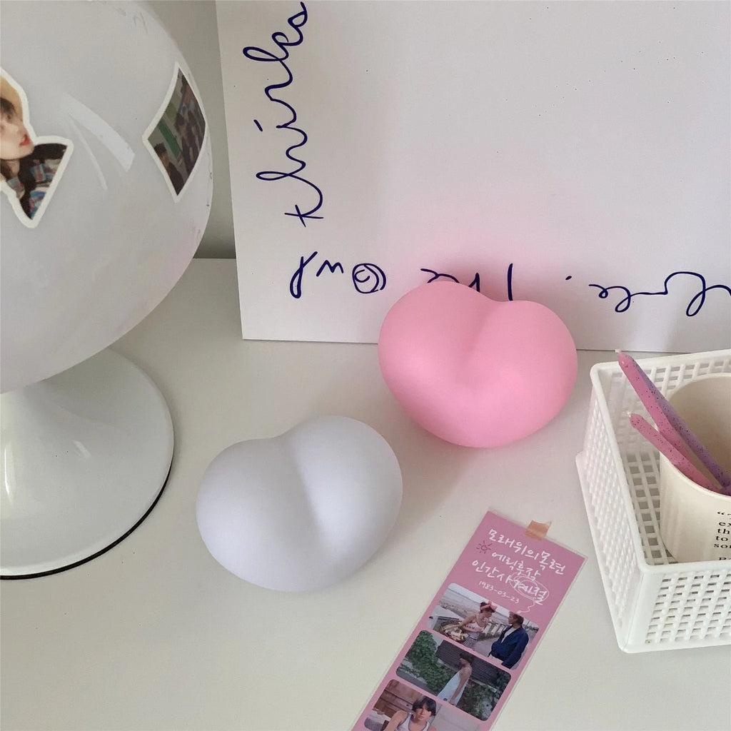 White and pink vinyl atmosphere lamps glowing warmly, shown in small and large size options.