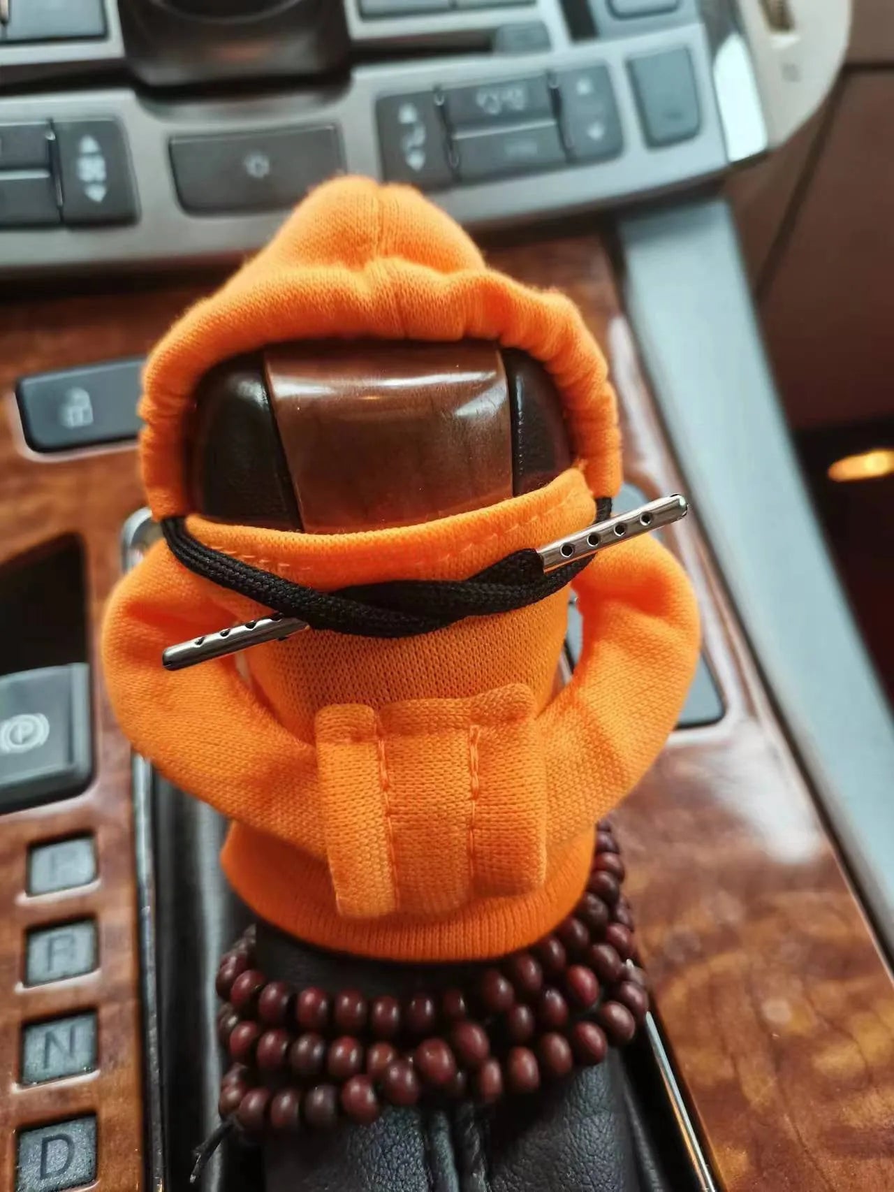Dutch velvet car gear handle sleeve cover in multiple colours on a car gear lever.