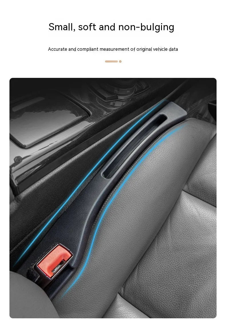 Black plastic car seat gap storage box with handle installed between car seats