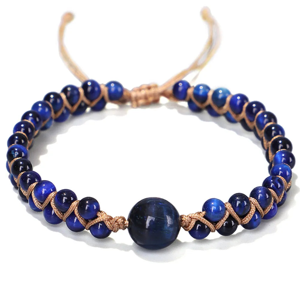 Handmade woven pull bracelet in blue Tigereye or amethyst with geometric design on wrist.