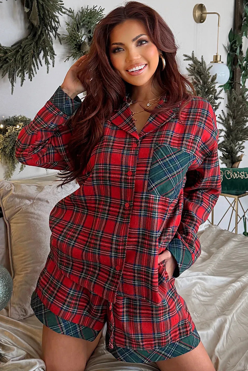Red Christmas pyjama set with plaid contrast patches showing long sleeve shirt and matching shorts