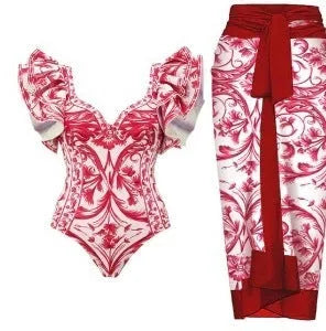 Women's printed polyester one-piece swimsuit on a hanger.