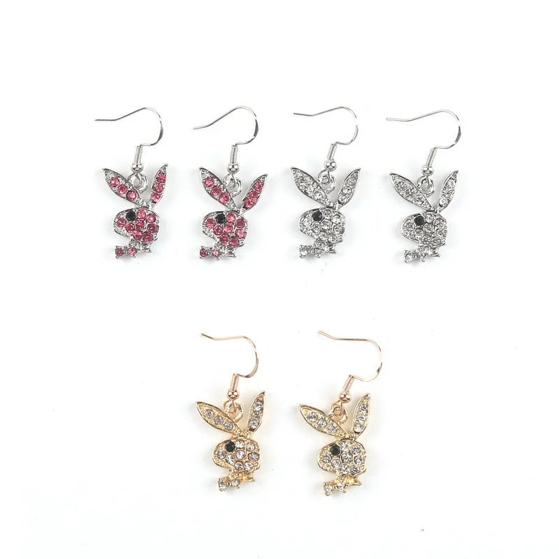 Cute rabbit-shaped stud earrings in silver, pink, or gold colour on a white background.