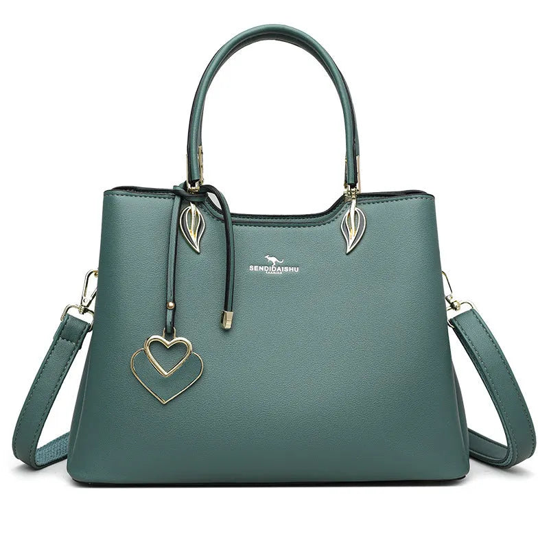 Women's black PU leather multi-compartment shoulder messenger bag with adjustable strap.