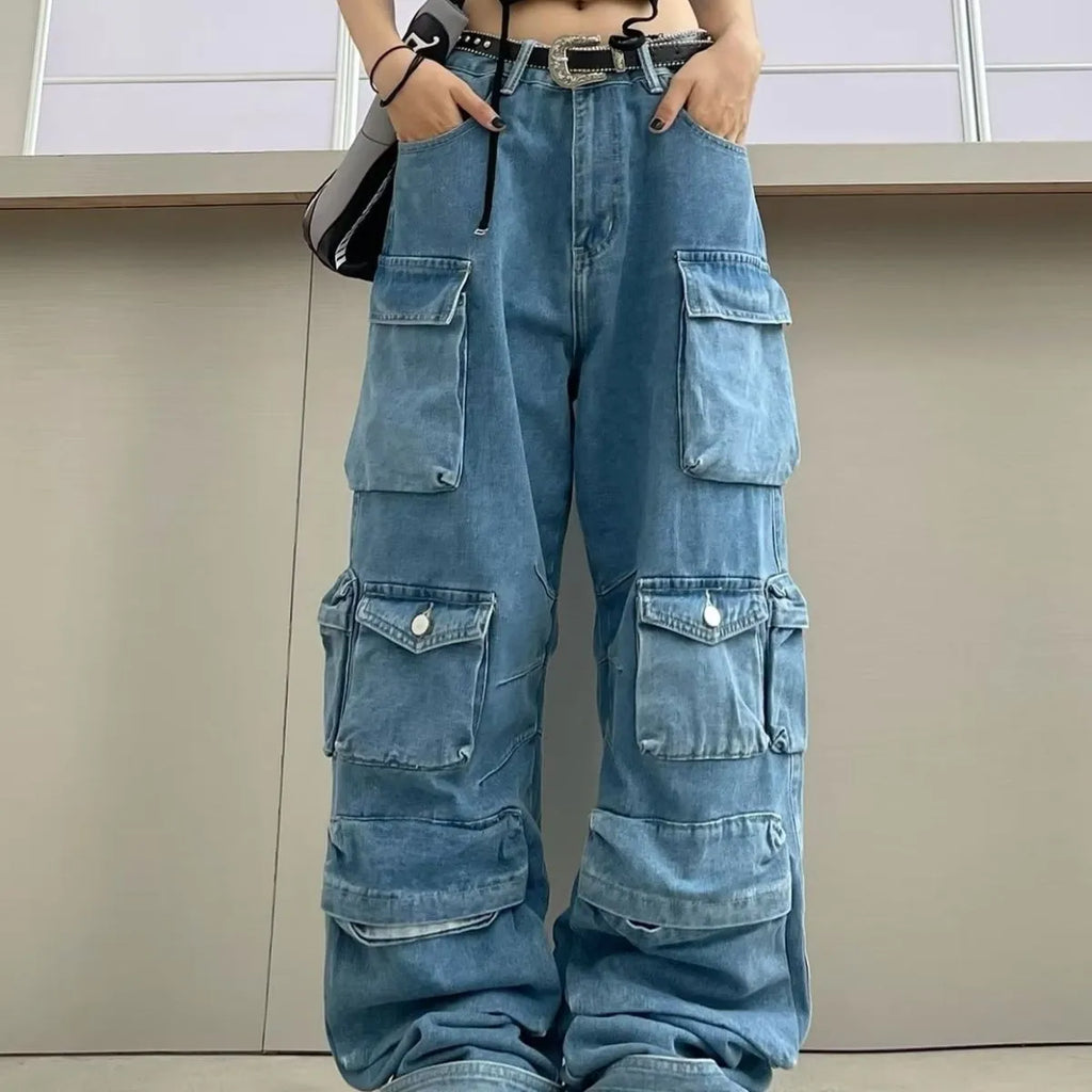 Women's blue tie-dyed high waist wide leg jeans with multiple pockets on a street style background.