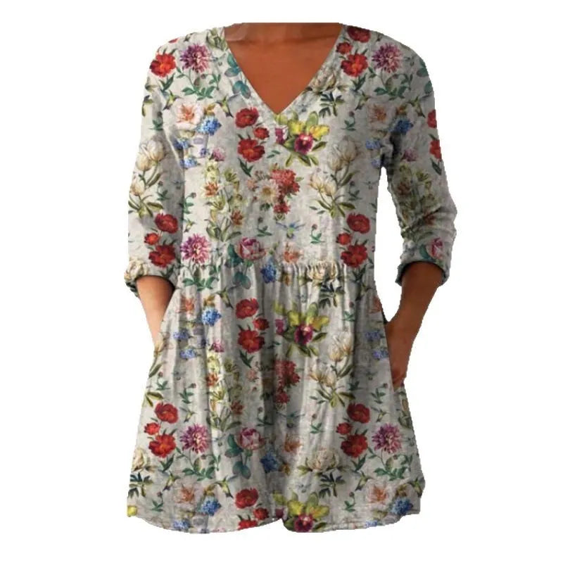 Women's long loose dress with a blue and white wave print pattern, featuring three-quarter sleeves and a wide waist.