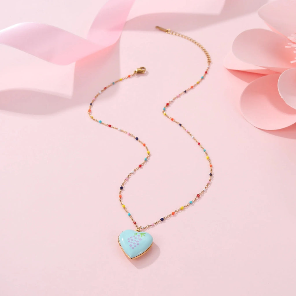 Women's stainless steel necklace with fruit pendant designs in gold plating on adjustable chain