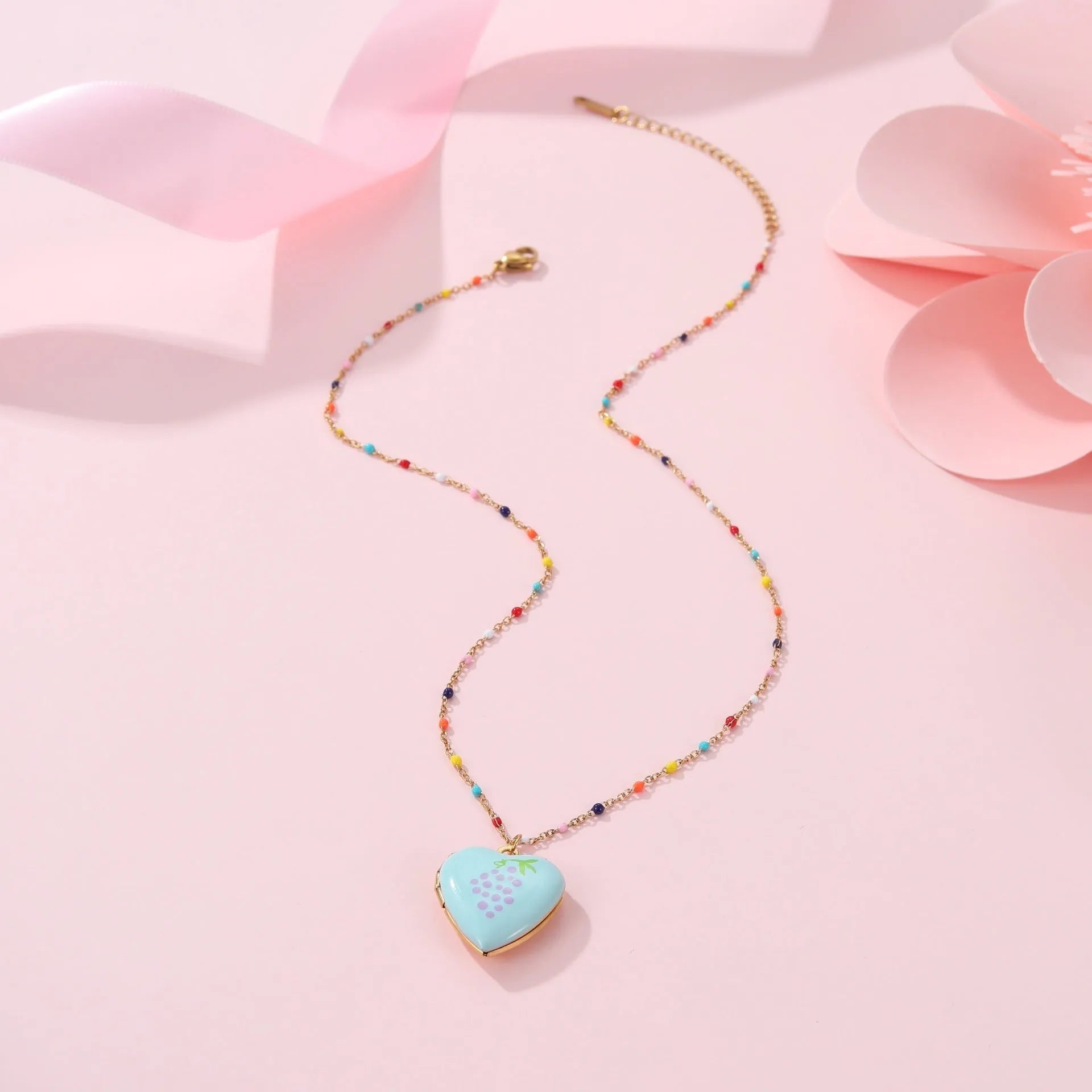 Women's stainless steel necklace with fruit pendant designs in gold plating on adjustable chain