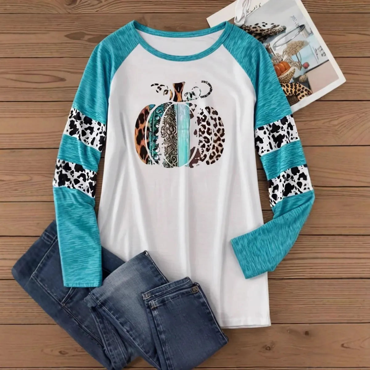 Sky blue long sleeve t-shirt with a detailed 3D printed Halloween pumpkin design on the front.