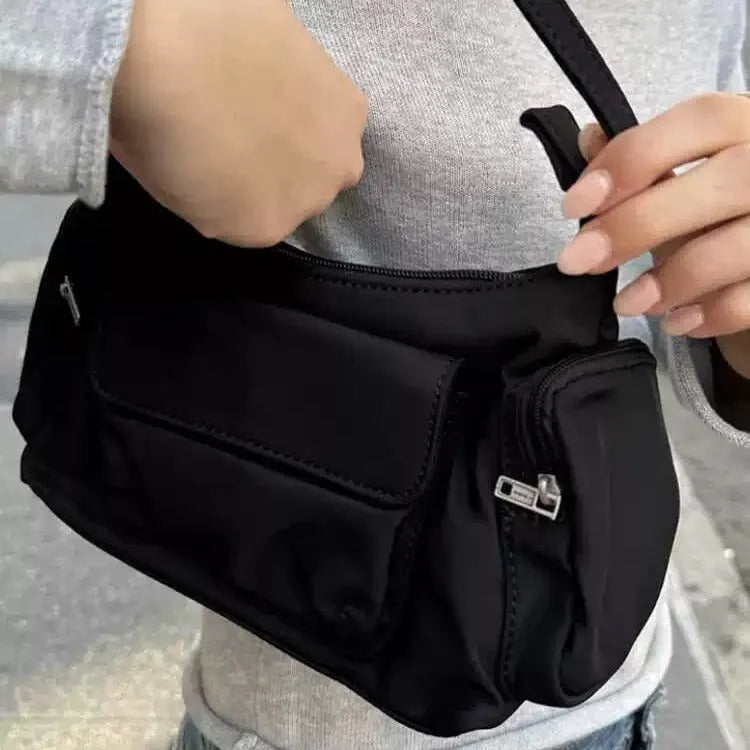 Black lightweight women's shoulder bag with double pockets and side line detailing