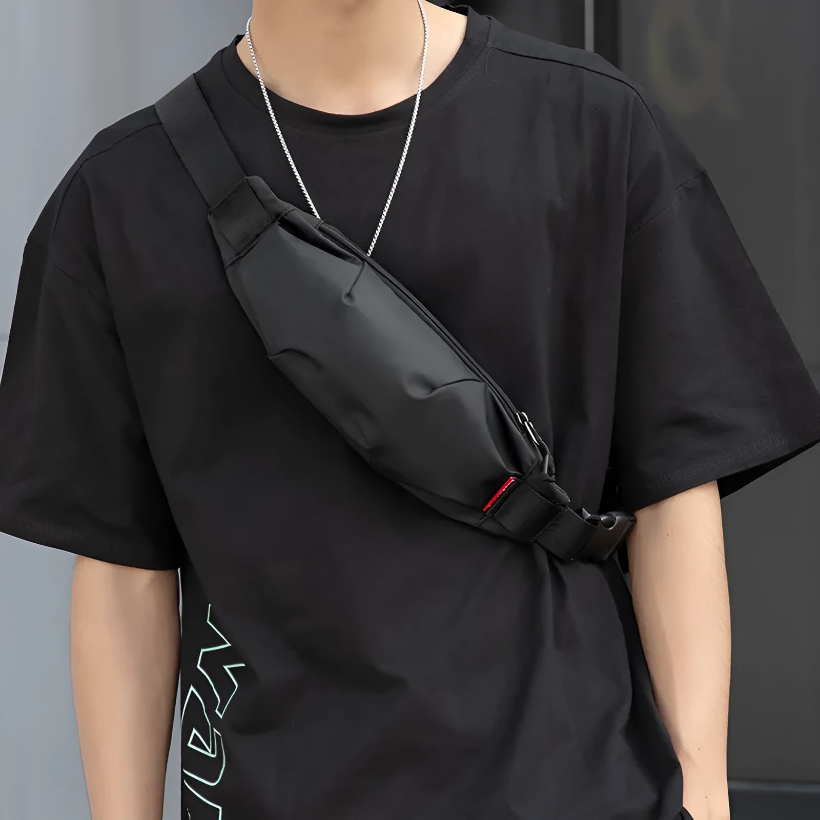 Black Oxford cloth crossbody waist pack with zippered opening showing interior organisation pockets