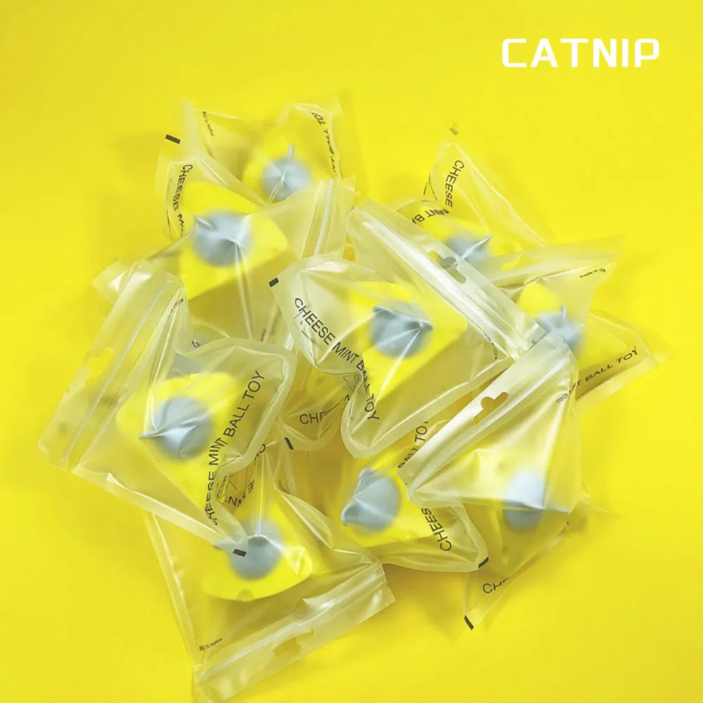 Yellow catnip and silvervine chew toy balls for cats with wall-mounting feature