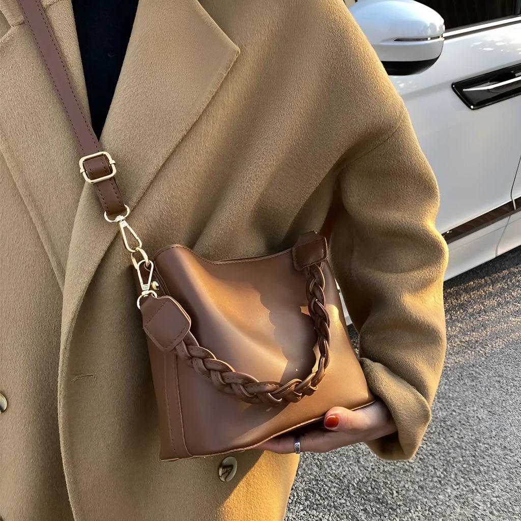 Retro khaki woven PU leather one-shoulder crossbody underarm bucket bag.