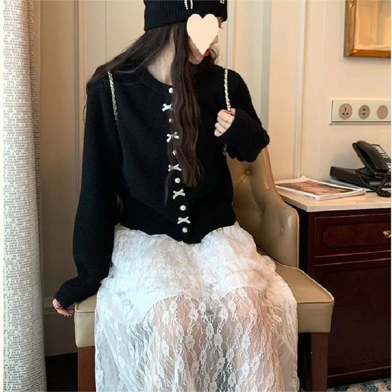 Women's solid colour cardigan sweater with bow and pearl button design in medium thickness fabric