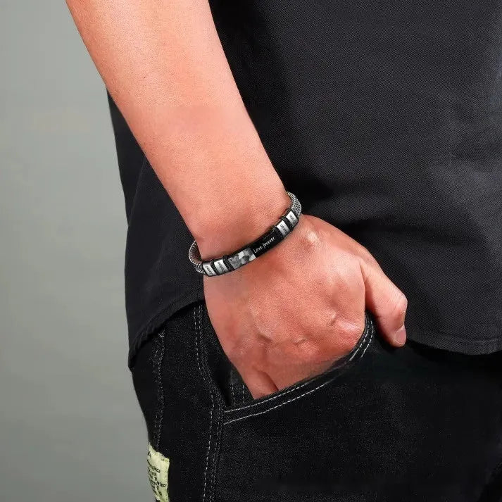 Men's titanium steel bracelet with leather rope band and heart-shaped lettering beads in a gift box.