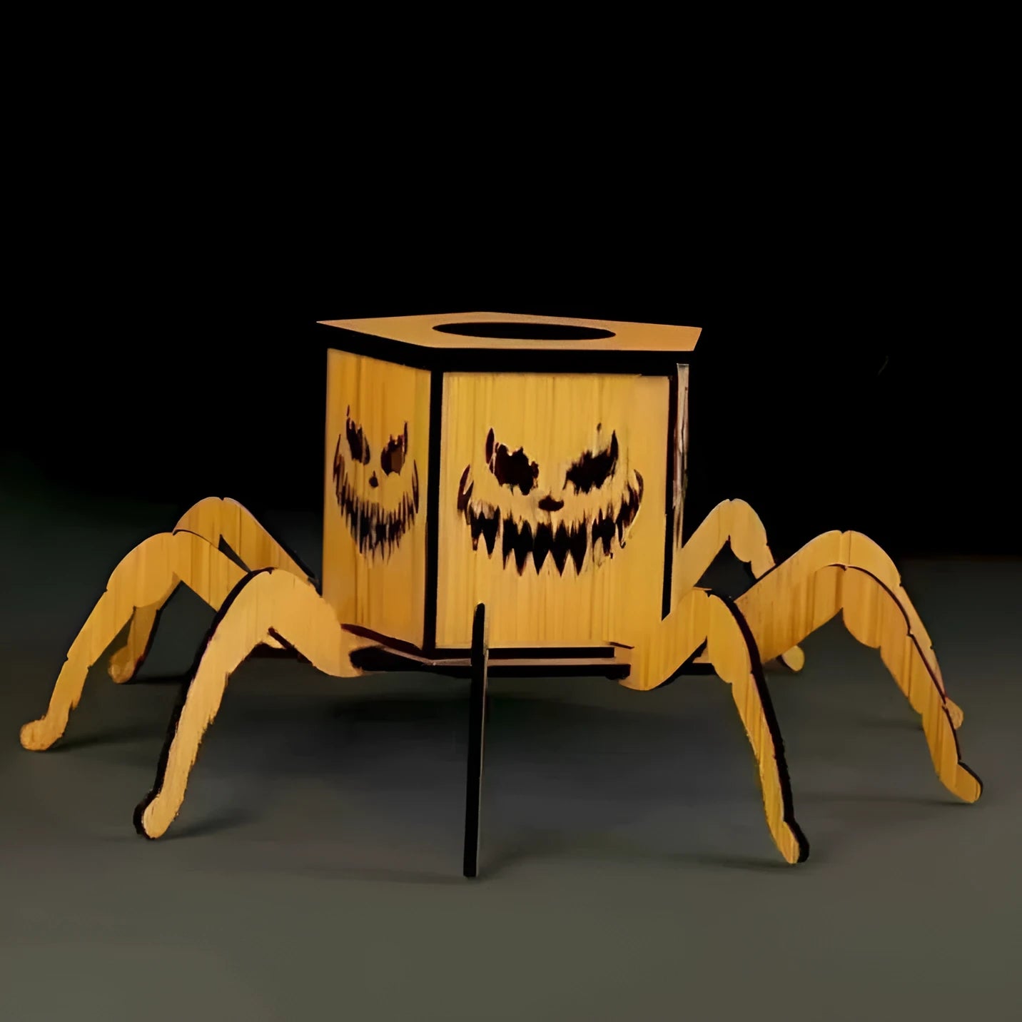 Wooden Halloween candlestick with spider design measuring 21cm by 8.5cm