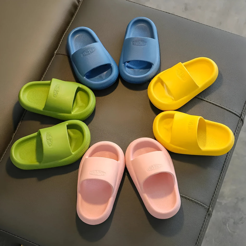 Mixed colour children's EVA slippers with non-slip soles in sizes for ages 24-35.