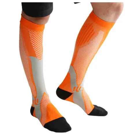 Graduated compression socks for men and women in black, shown laid flat.