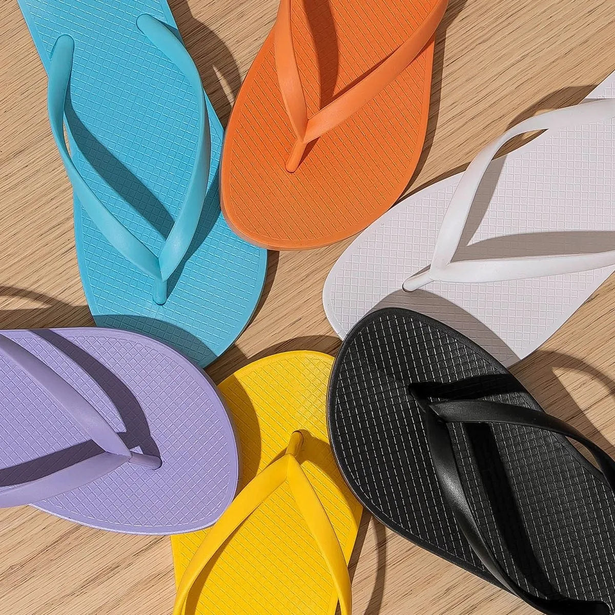 Seaside beach slippers with hollow-out PVC soles in orange, purple, black and white colours