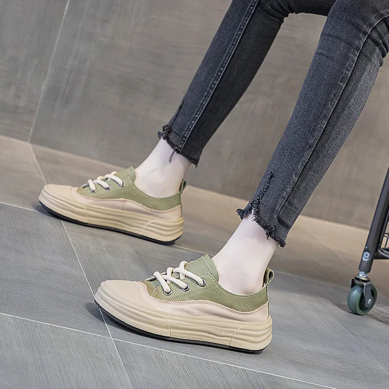 Women's leather platform sneakers in matcha green, showing lace-up front and round toe design.