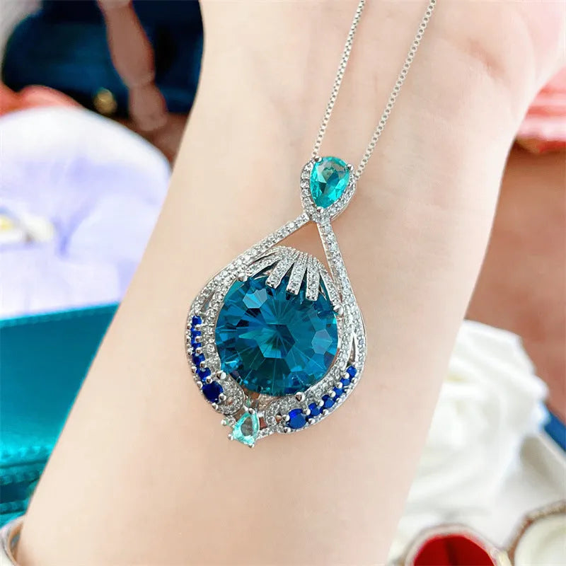 Blue geometric crystal pendant necklace with fireworks cut on a water wave chain for women