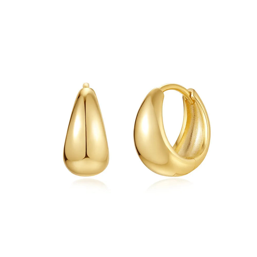 Geometric brass earclip earrings with round elements in golden and gold finishes
