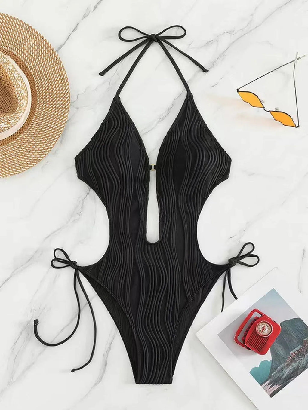 Women's black lace-up triangle bikini swimsuit on a mannequin