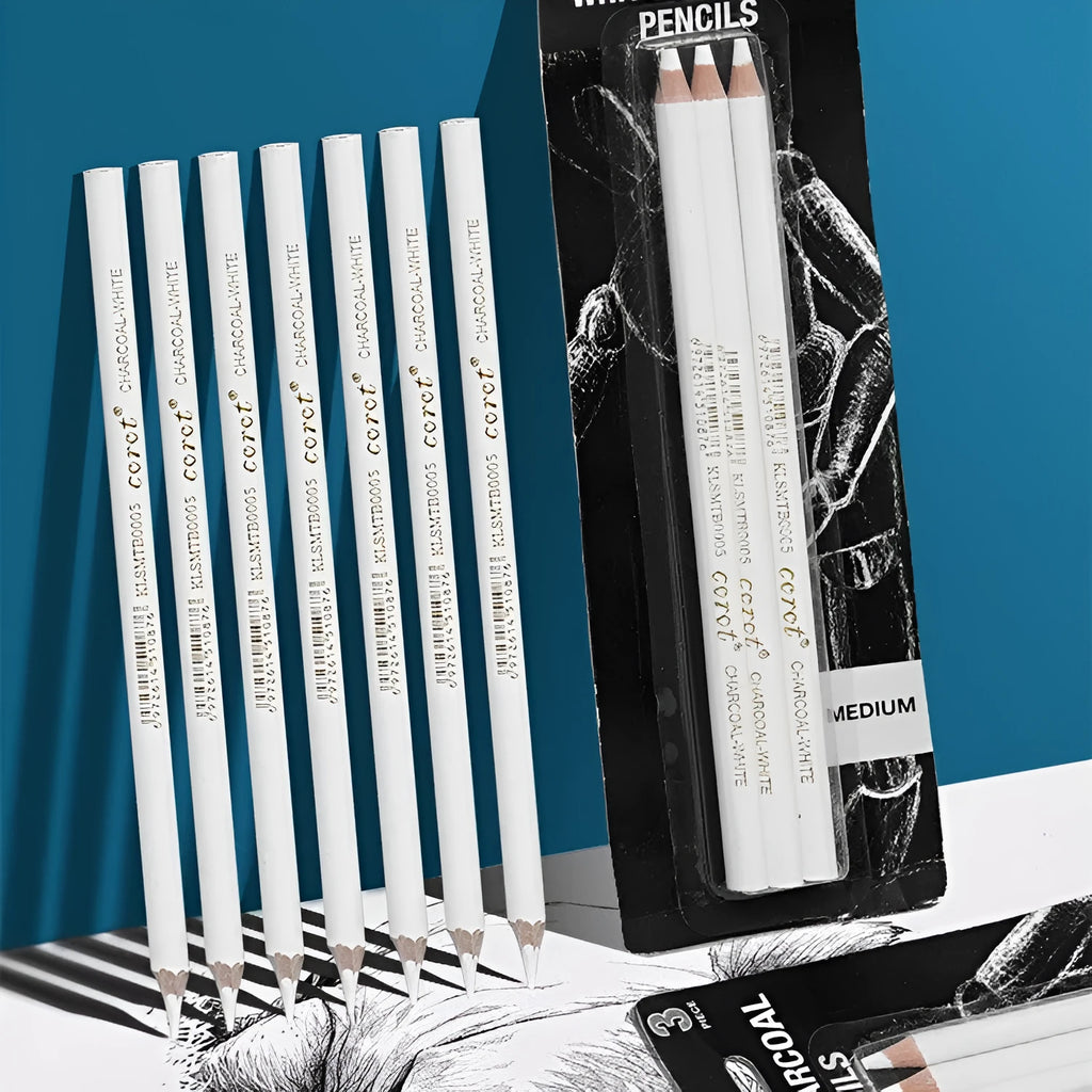Three white charcoal sketching pencils with wooden barrels for highlighting artwork