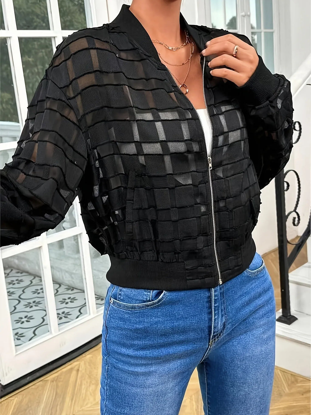 Black women's casual jacket with geometric pattern and front zipper.