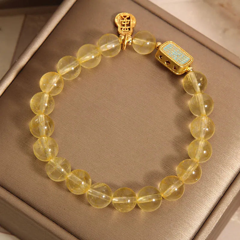 Women's natural citrine crystal bracelet with yellow colour and rhinestone detailing