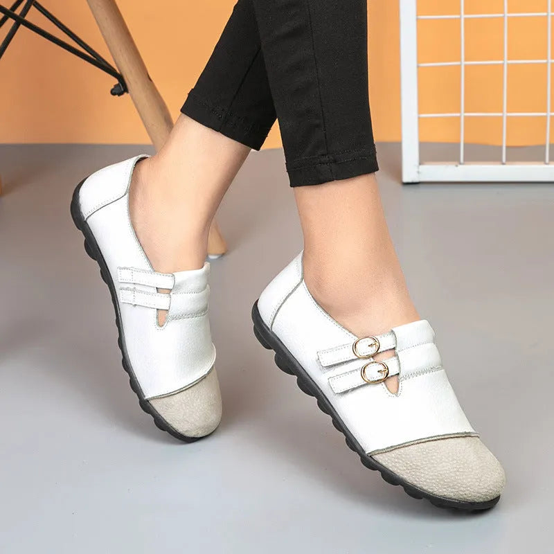 Women's casual flat shoes with Velcro fastening in black, showing round toe and beef tendon sole