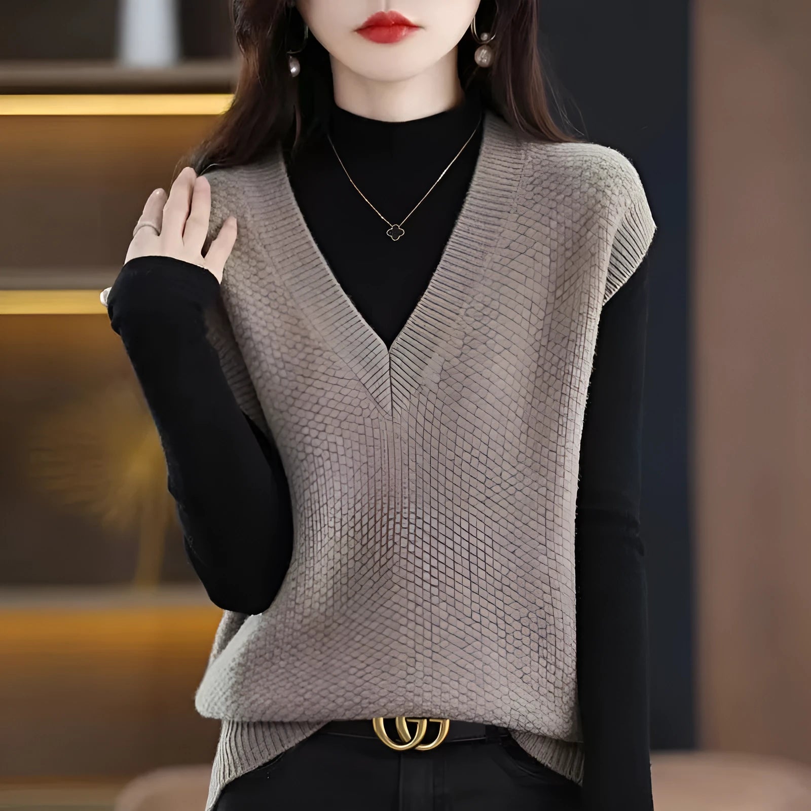 Sleeveless V-neck pullover vest with a textured 3D knit pattern in acrylic fabric, shown in multiple colours.