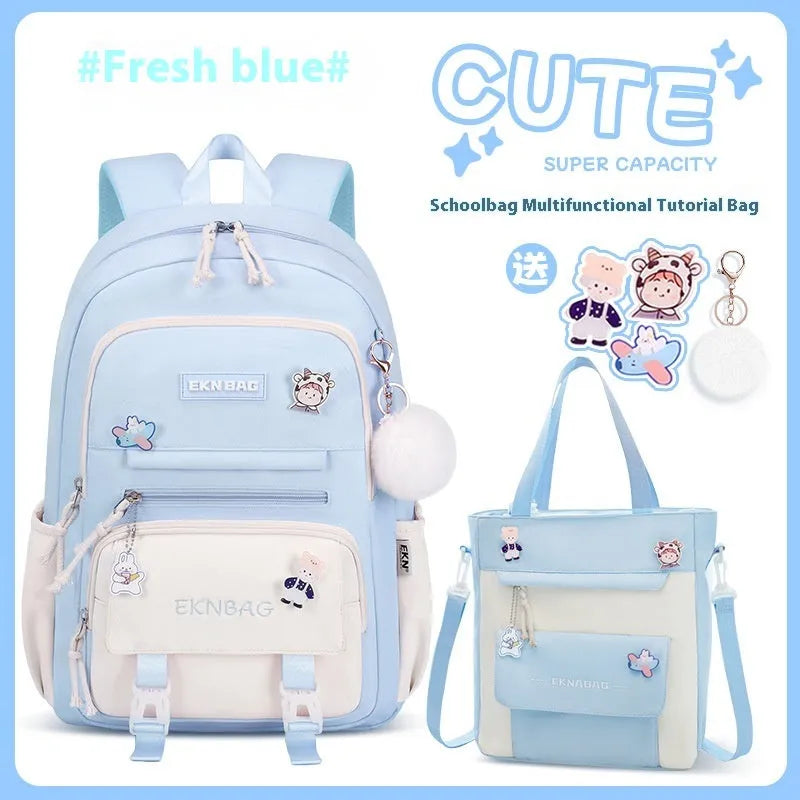 Pink waterproof Oxford cloth school backpack for girls with curved shoulder straps on a white background.