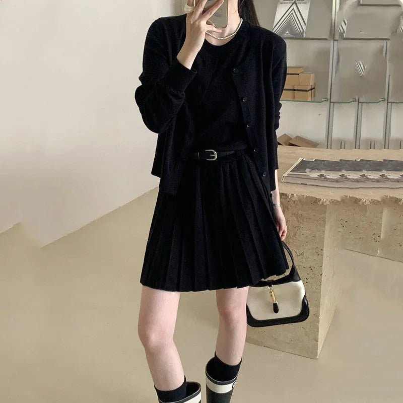 Women's grey knitted two-piece set with vest skirt and long-sleeved cardigan in art retro style