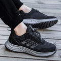 Breathable mesh mum shoes with non-slip sole and elastic band in purple, black, and dark grey colours.