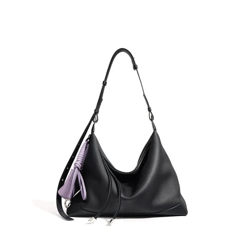 Full-grain leather women's crossbody bag in biscuit with spliced design and zip closure