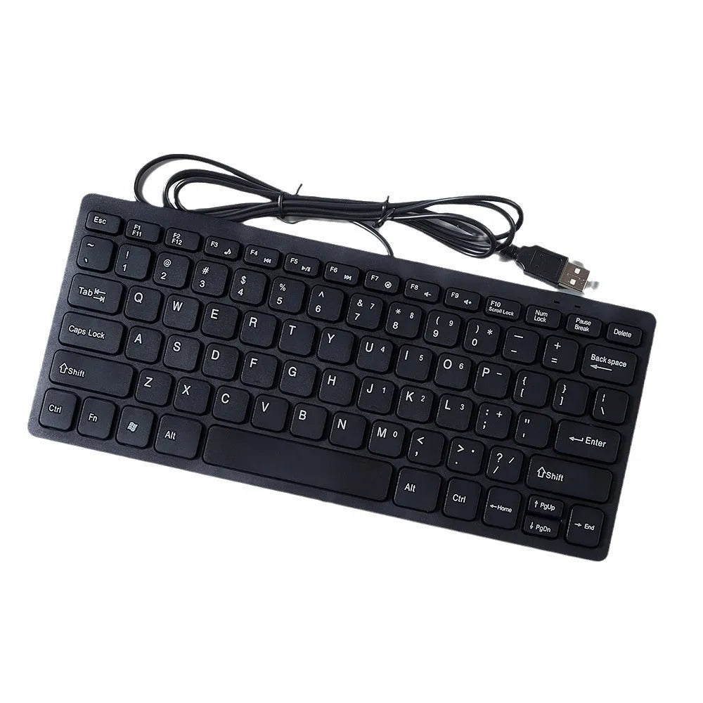 Compact USB wired mini keyboard in black, white, pink, or blue on a desk.