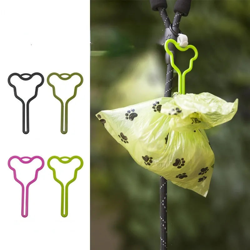 A dog poop bag holder with a fixed clip and adjustable Velcro strap, shown in a random colour.