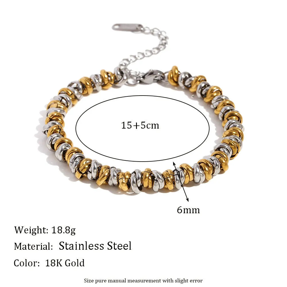 Women's gold electroplated geometric jewellery set with earrings, bracelet and necklace on stainless steel