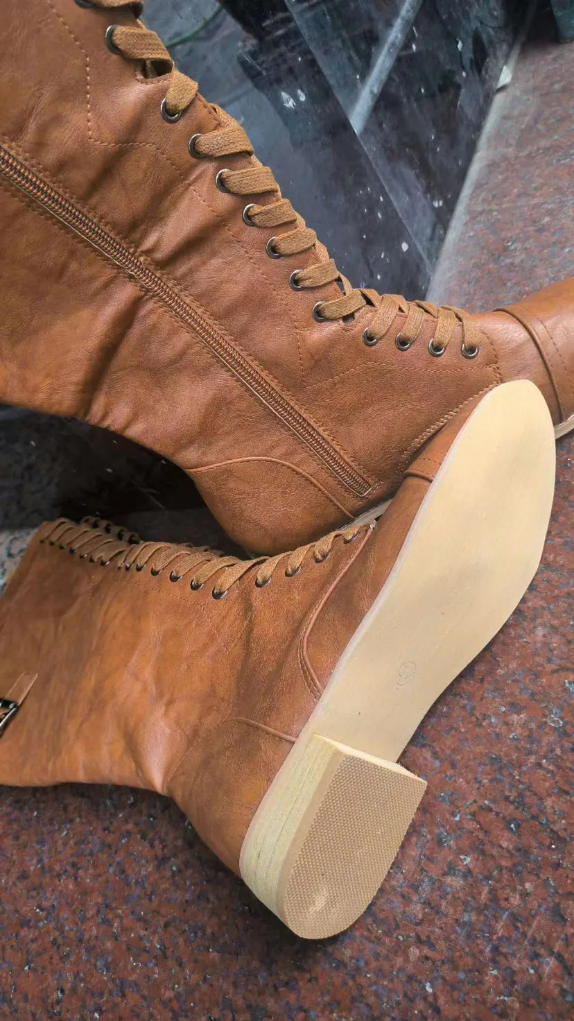Women's black cross-strap knight boots made from artificial PU, side view.