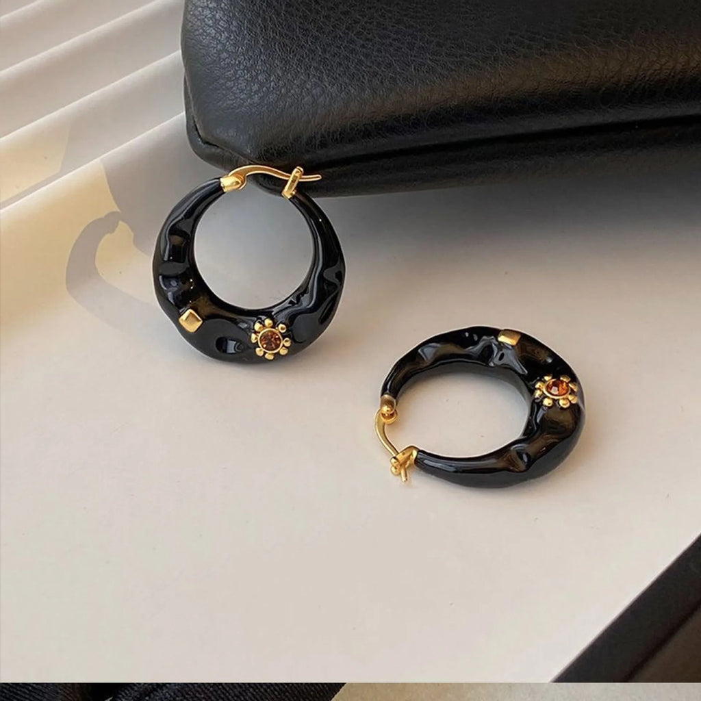A pair of retro Hong Kong style alloy ear studs with rhinestone inlay, shown in black and red colour options.