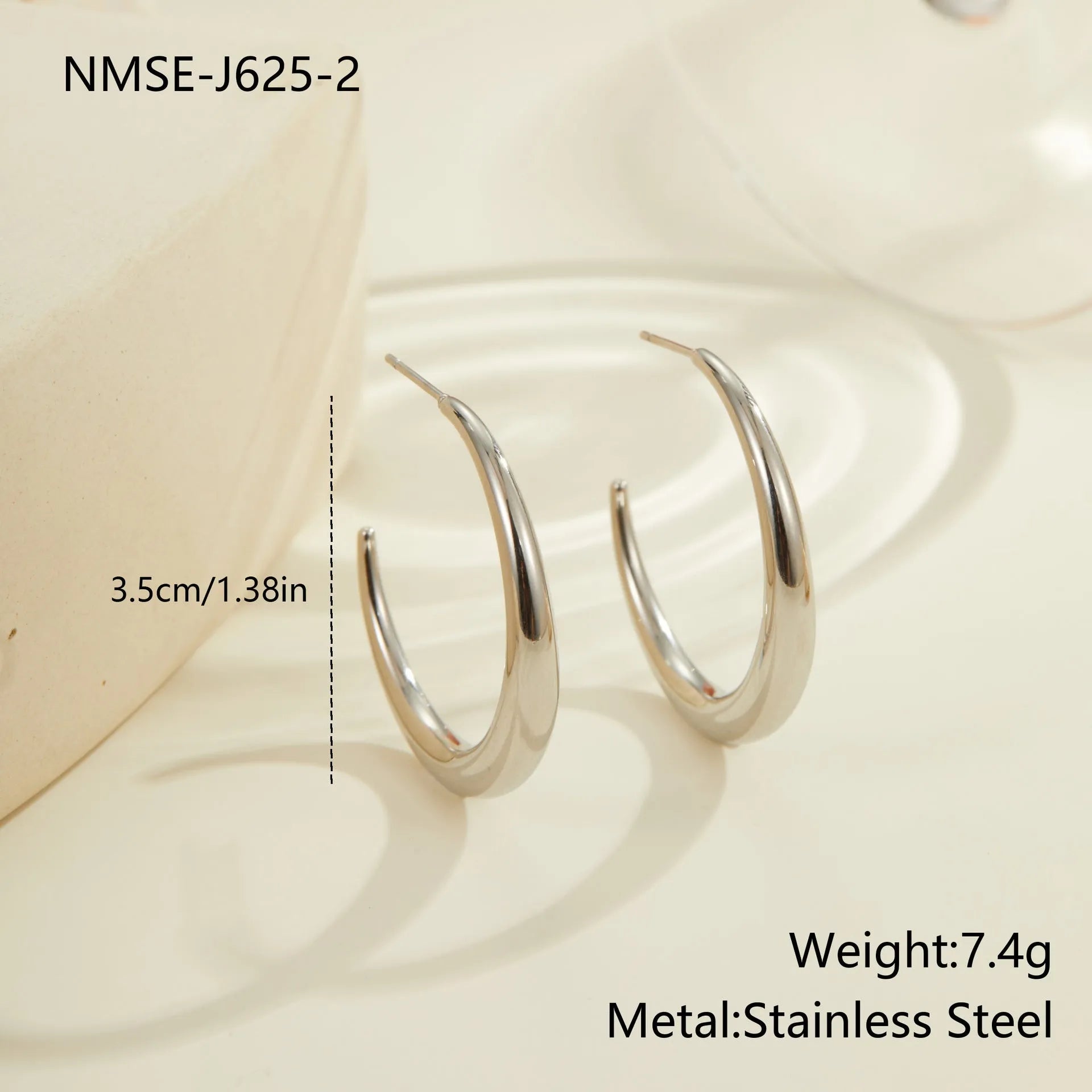Women's stainless steel hoop earrings with 18K PVD gold plating in geometric round design