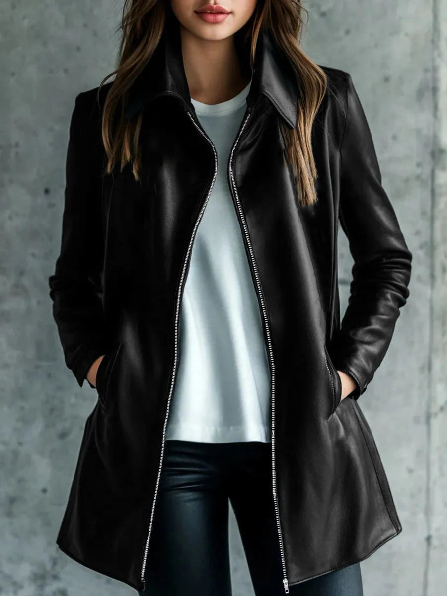 A black medium-length women's leather jacket with long sleeves, laid flat.
