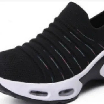 Women's stretch knitted sock shoes in various colours showing mesh upper and round toe design.