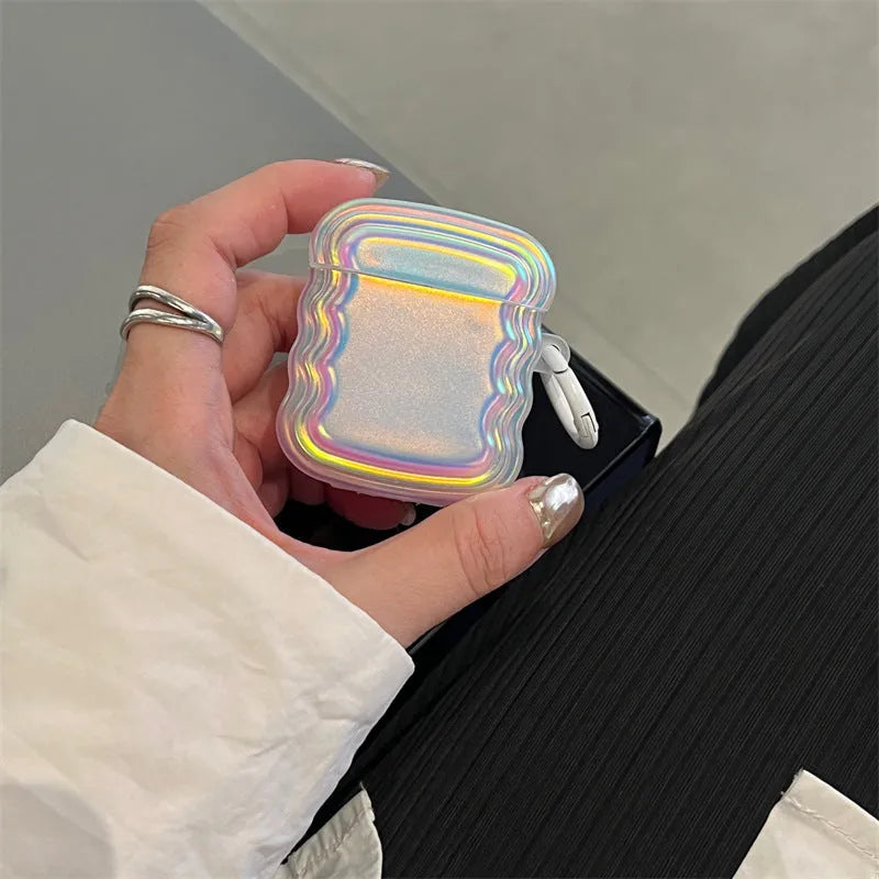 Silicone protective case for AirPods with a magic laser and ring etched design on the front.