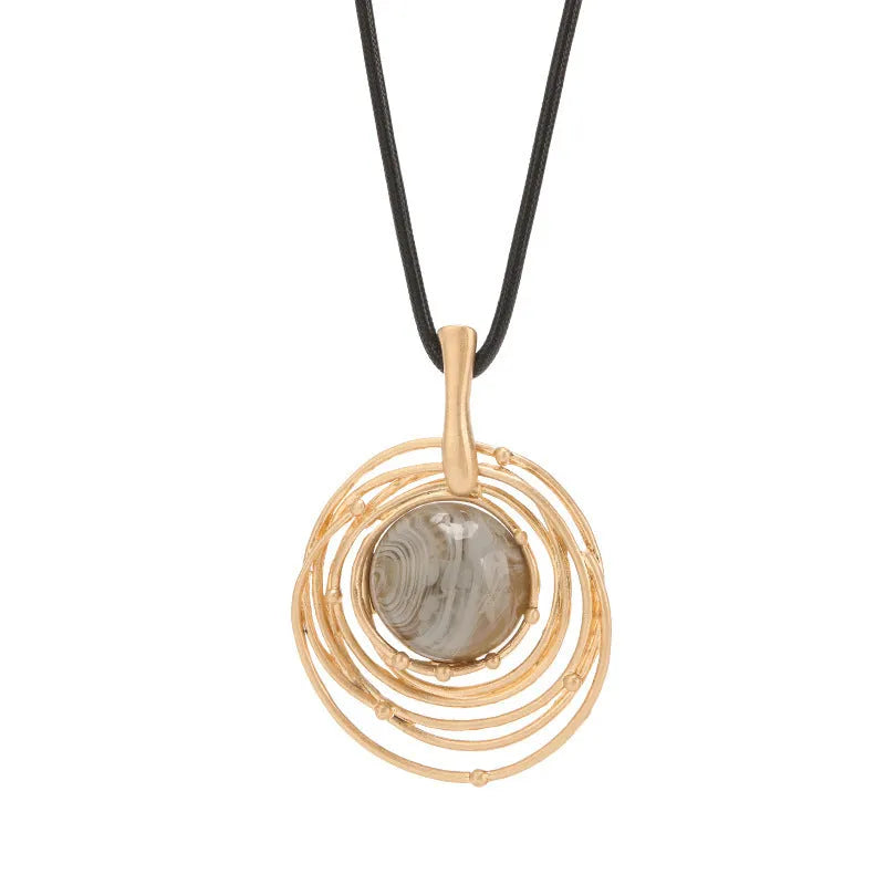 Vintage gold sweater chain necklace with large round plaid pendant on adjustable snakeskin wax rope.