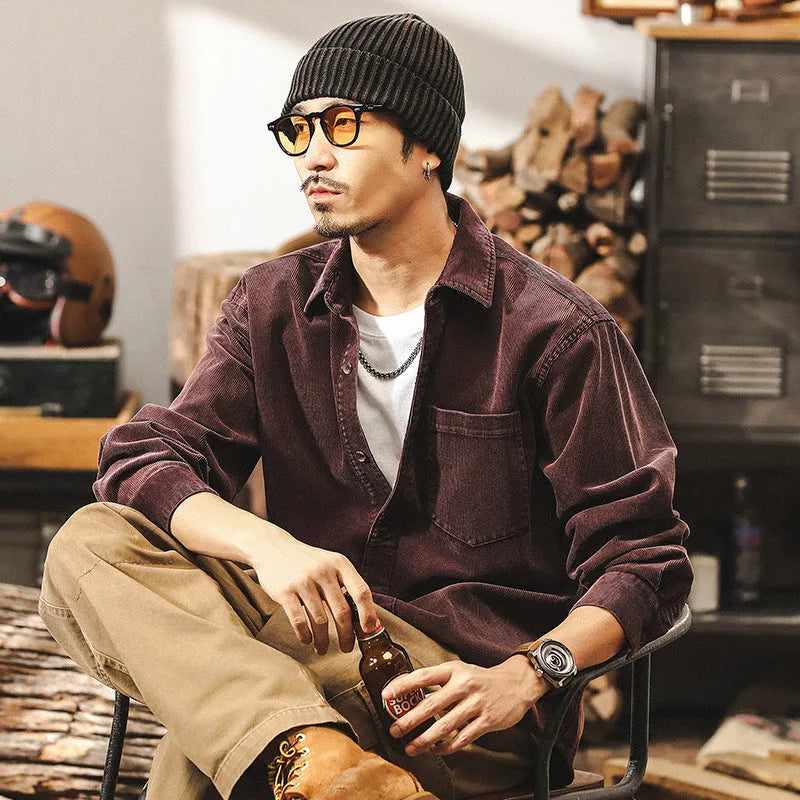 Men's black loose-fit retro corduroy shirt jacket with long sleeves.