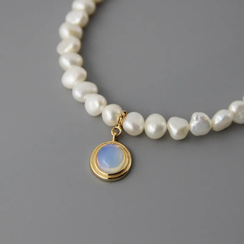925 silver round medal pearl pendant necklace with irregular pearl geometric design on white background