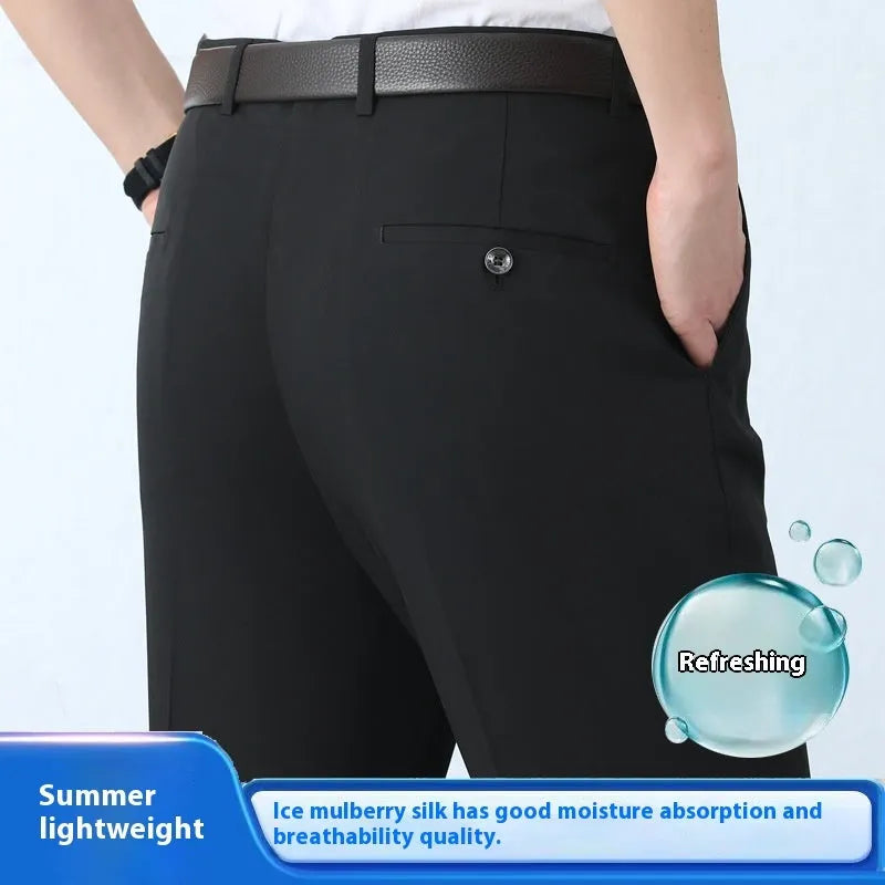 Man wearing dark blue straight-leg suit pants with a high waist, made from a non-ironing mulberry silk blend fabric.
